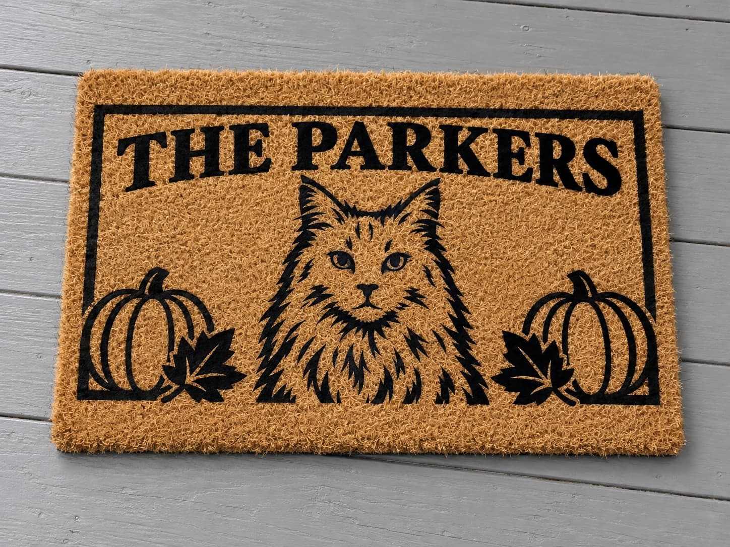 Autumn Nameplate coir mat photographed in a studio
