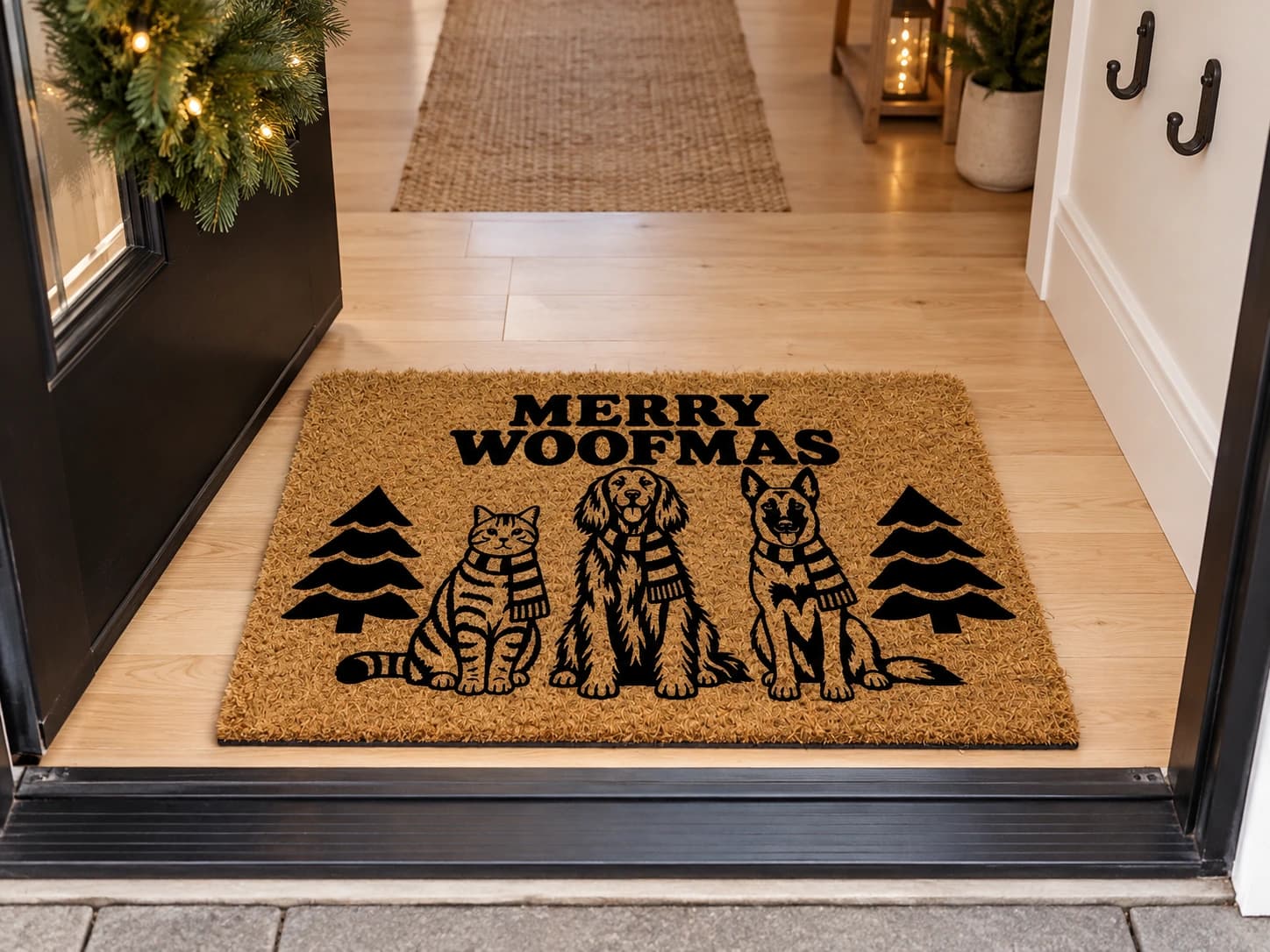 Merry Woofmas coir mat on the entryway floor inside the front door