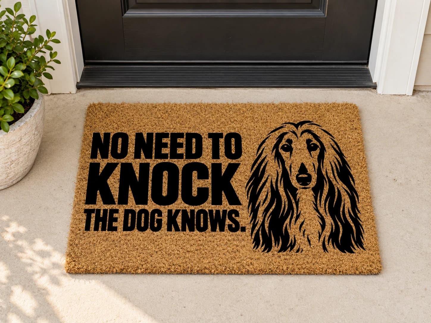 The Doorbell coir mat outside a covered front door