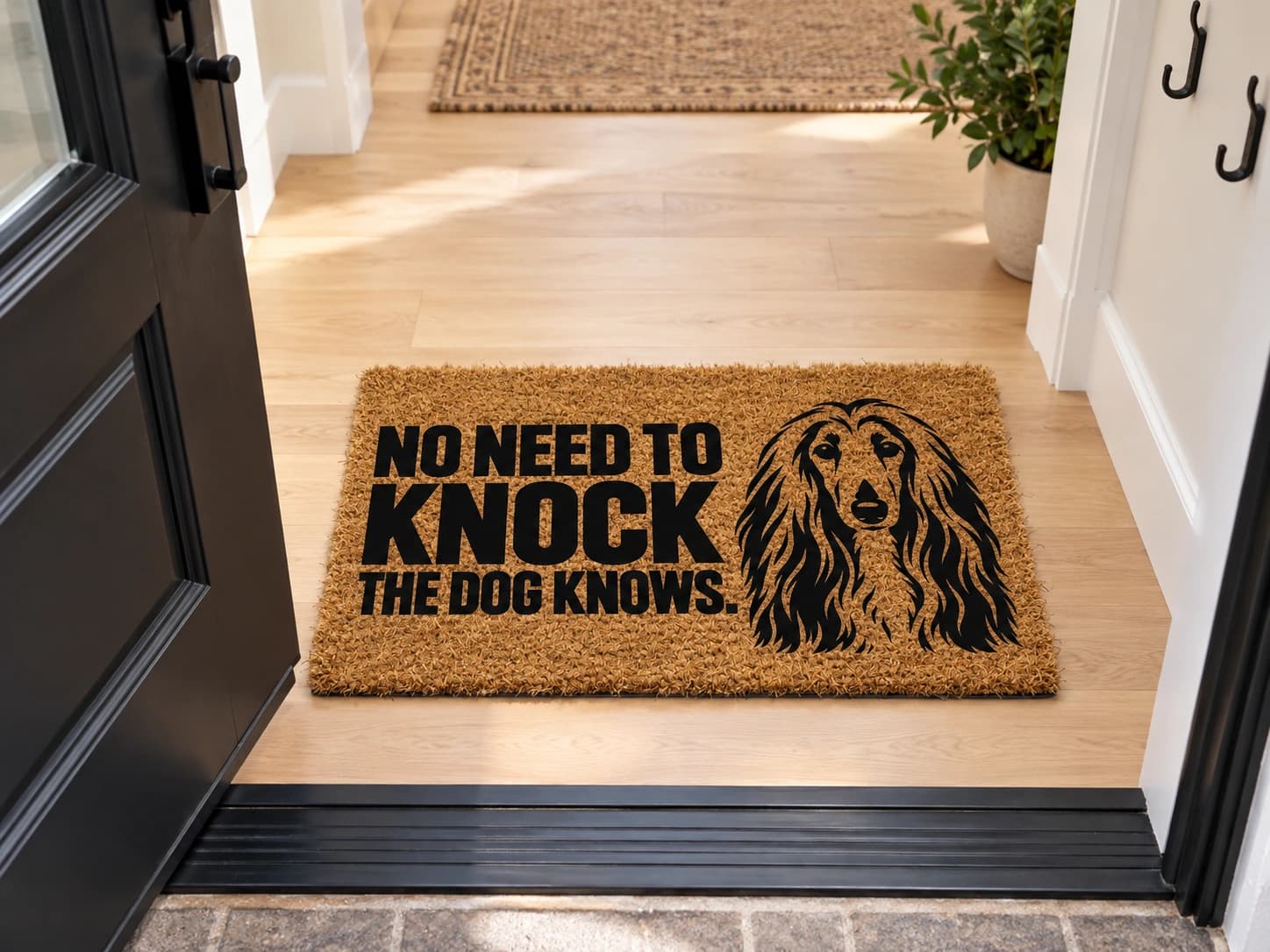 The Doorbell coir mat on the entryway floor inside the front door